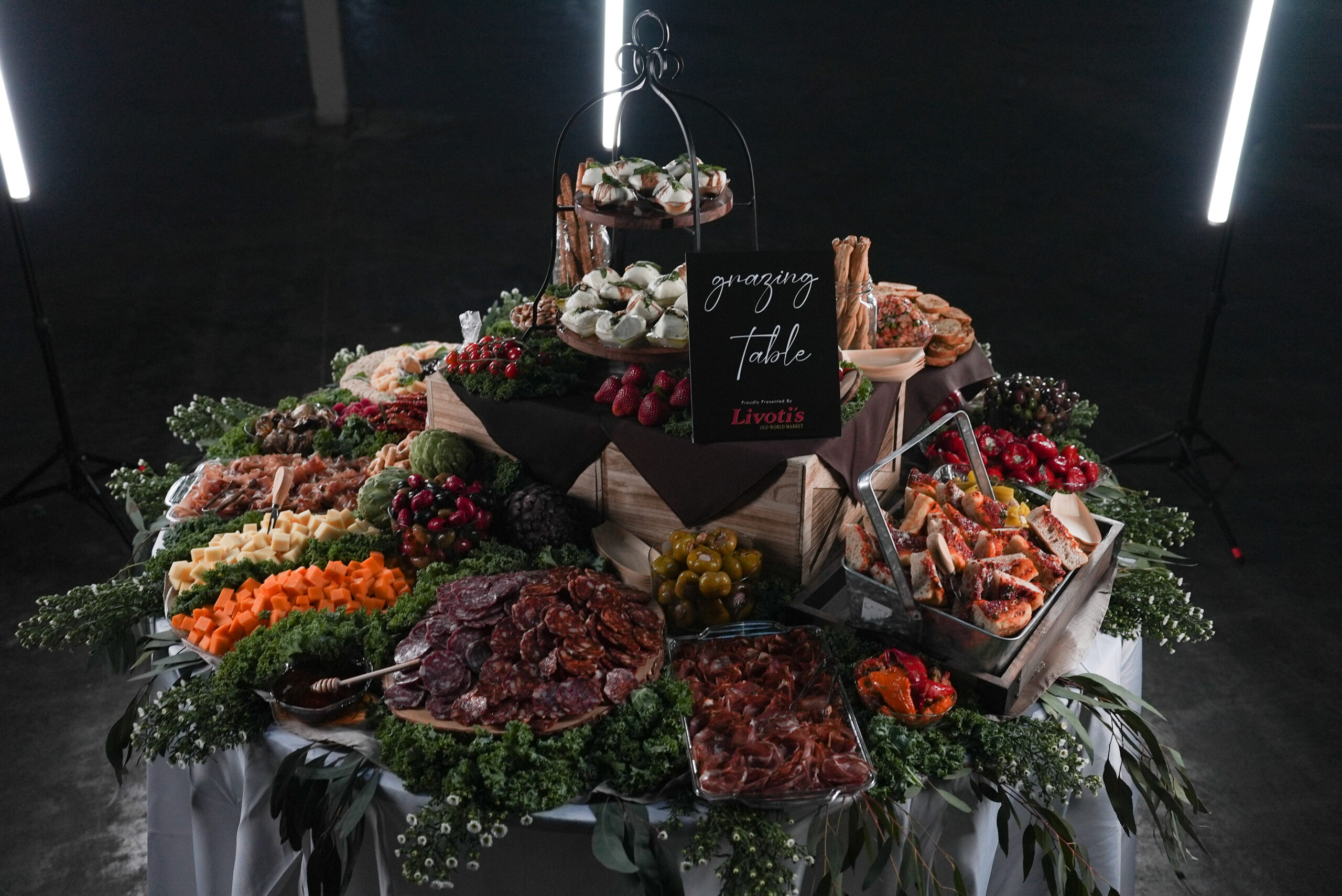 Grazing Table with meat, cheese, bread, and more arranged by Livoti's Old World Market